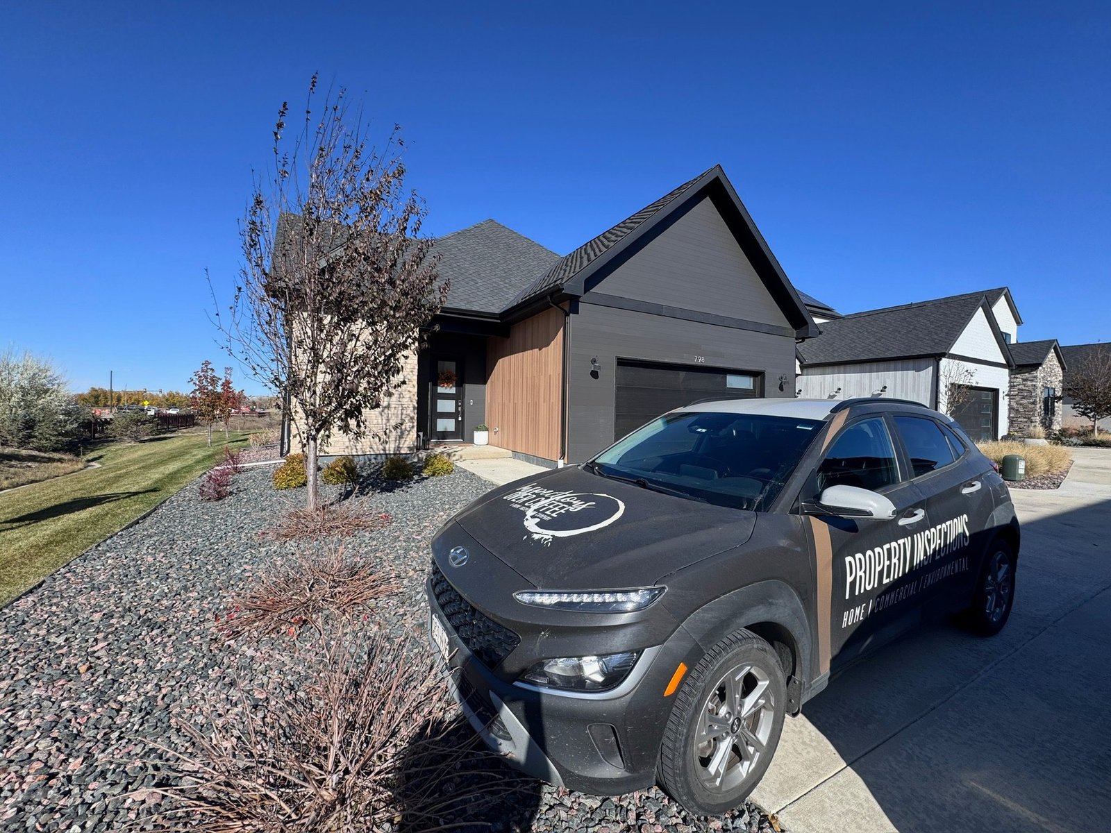 Inspections Over Coffee branded vehicle at a Colorado home inspection