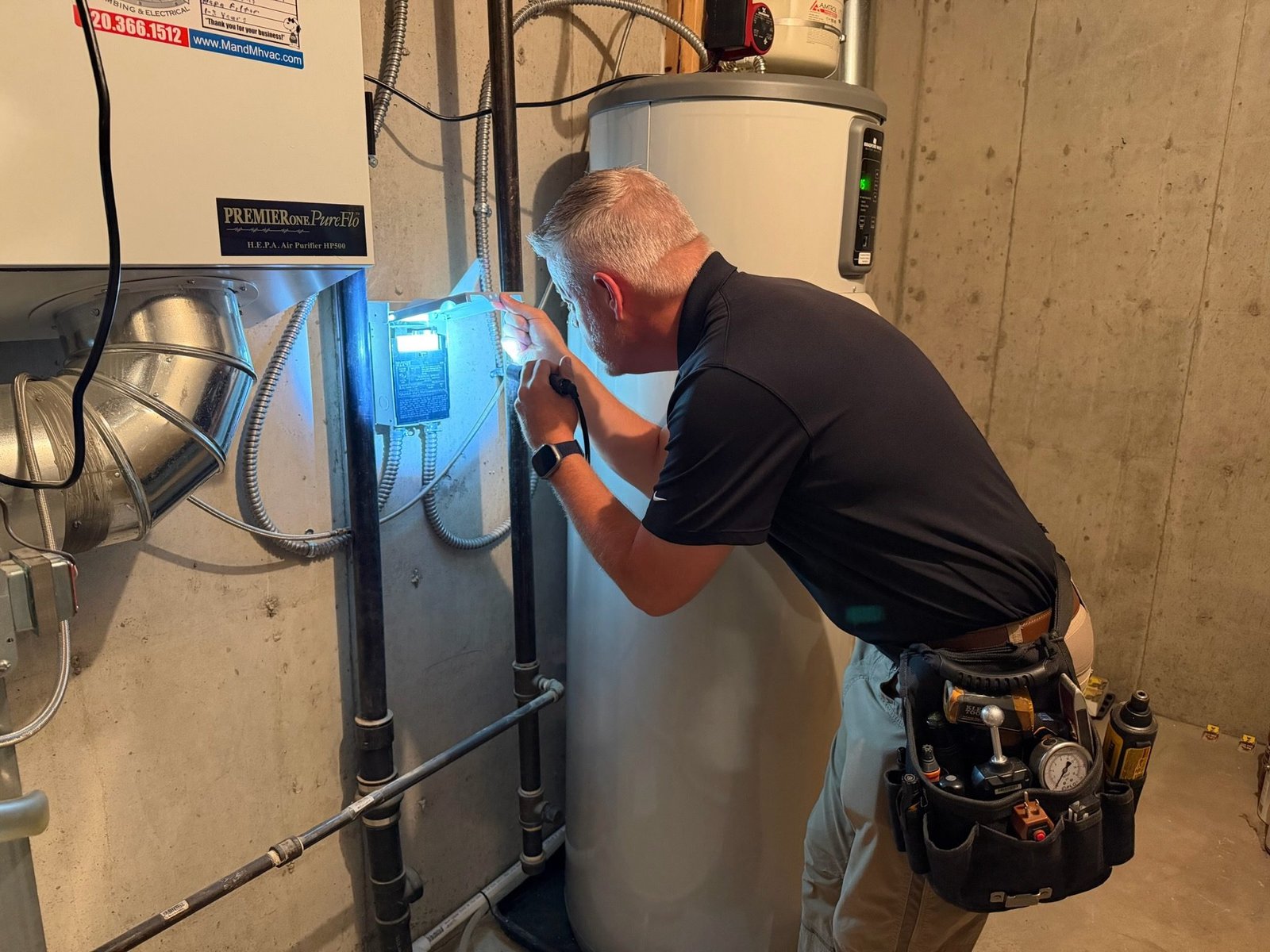 Boulder home inspector checking a water heater installation