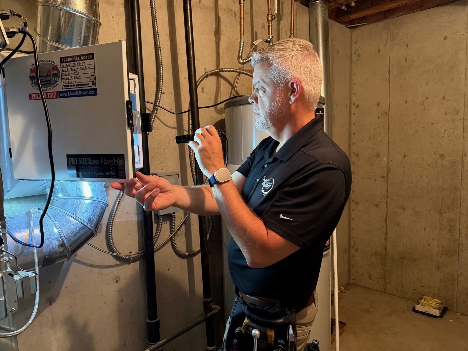 Boulder home inspector examining an electrical panel