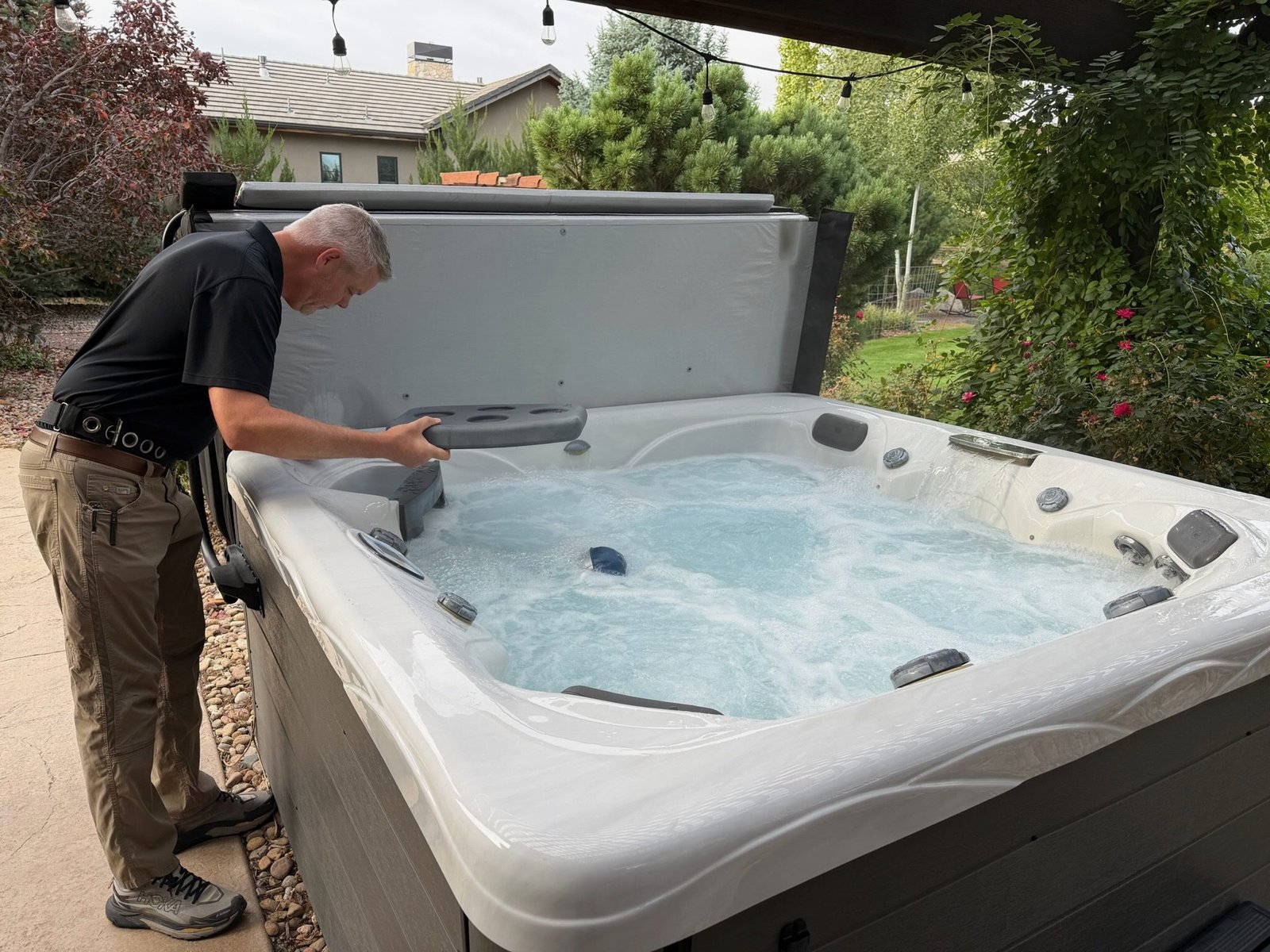 Boulder home inspector checking a backyard hot tub